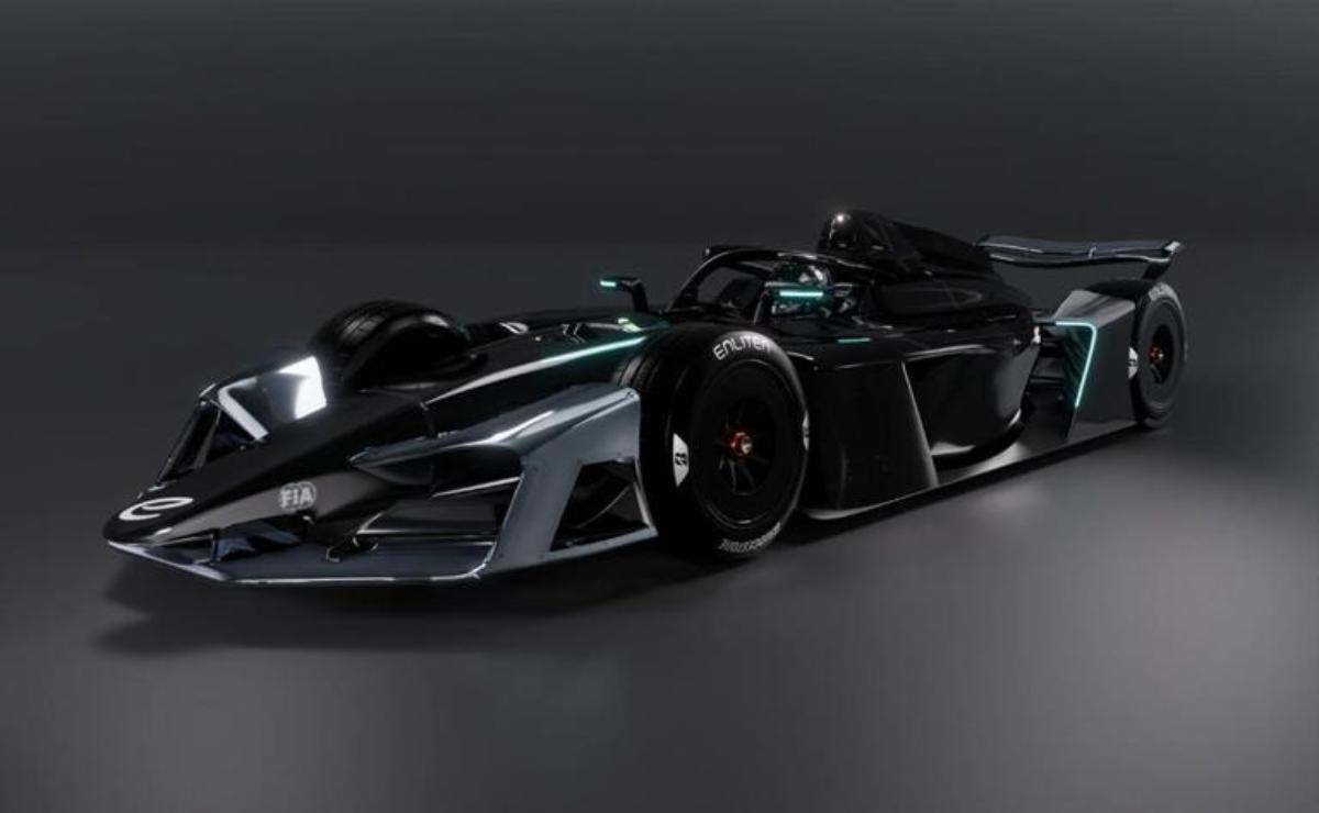 Futuristic black race car with sleek aerodynamic design under studio lights.