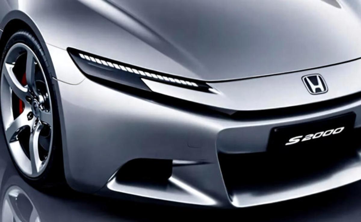 Close-up of a sleek silver car front with futuristic LED headlights.