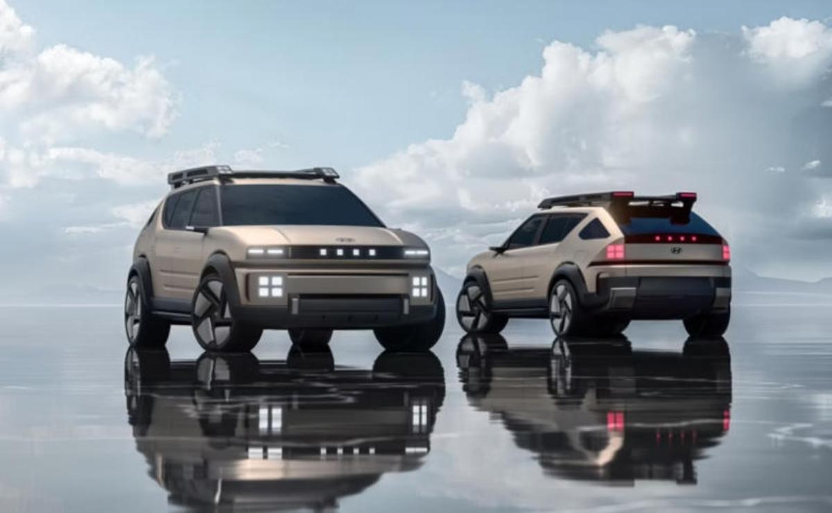 Two futuristic electric SUVs parked on a reflective surface under a cloudy sky.