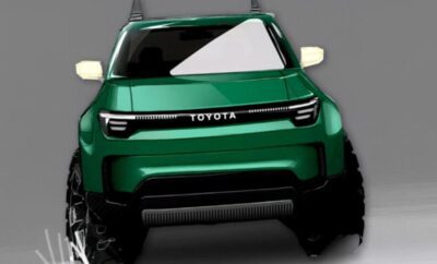 Front view of a green Toyota SUV with modern headlights.