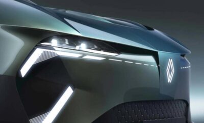 Close-up of a futuristic car's sleek LED headlights and grille design.