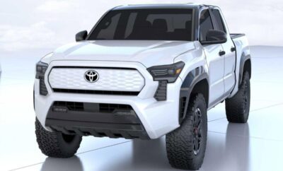A white Toyota pickup truck with rugged tires and aggressive front design.