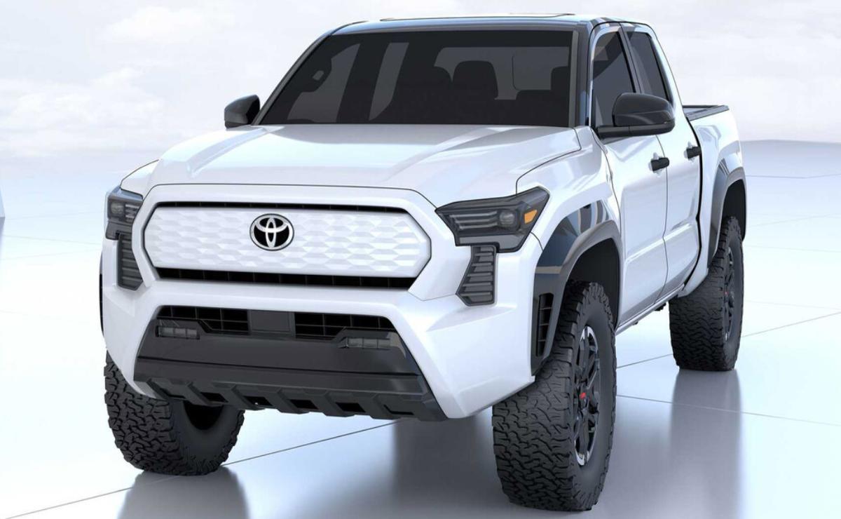 A white Toyota pickup truck with rugged tires and aggressive front design.