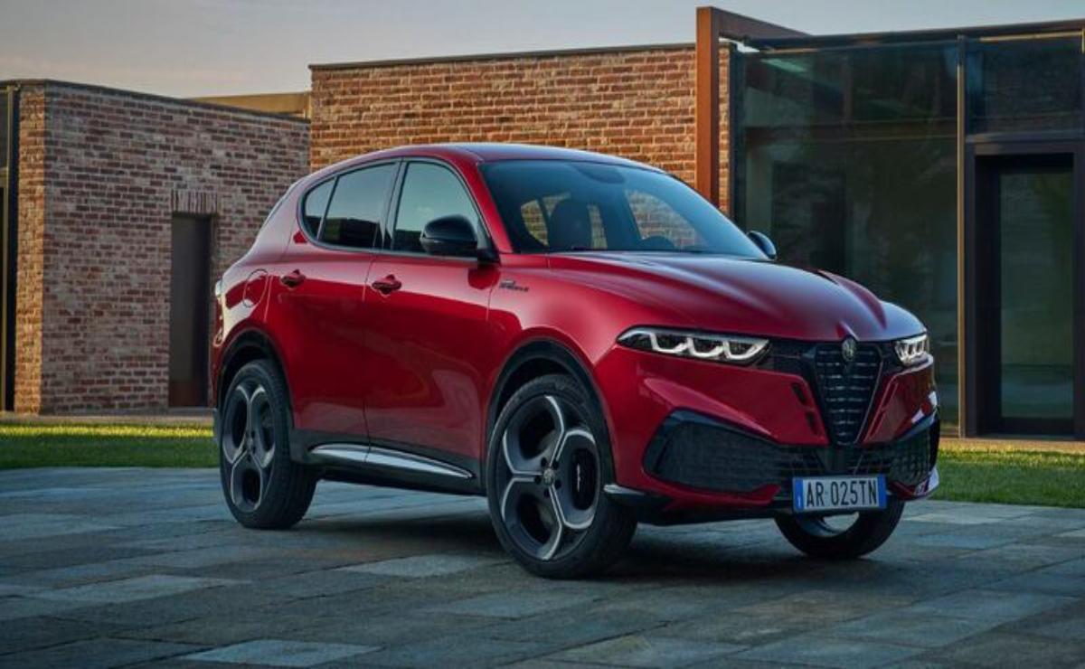Red Alfa Romeo SUV parked outside a modern building.