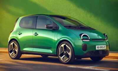 A sleek green compact car with futuristic design elements.