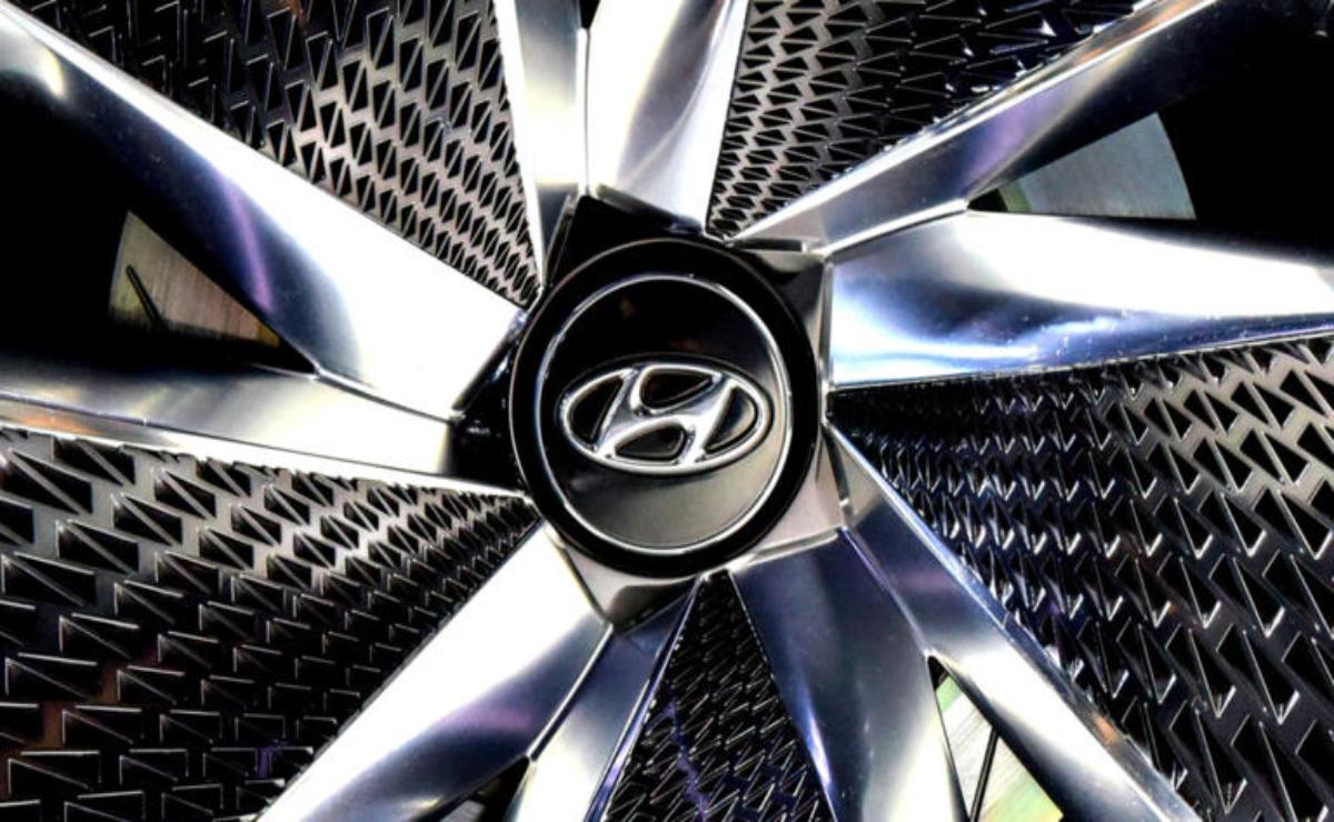 Close-up of a shiny Hyundai car wheel rim with logo.
