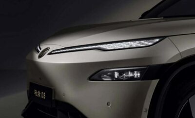 Close-up of a sleek car front with modern LED headlights.