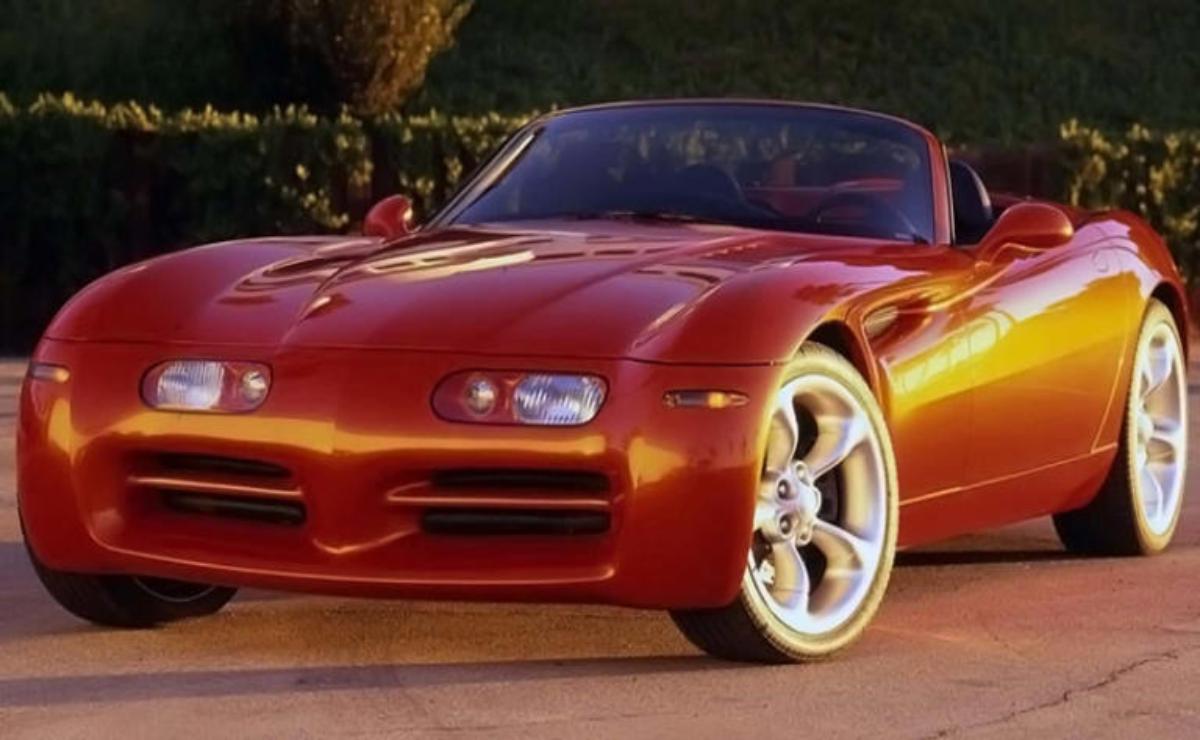 Shiny red sports car parked outdoors with sunset lighting.