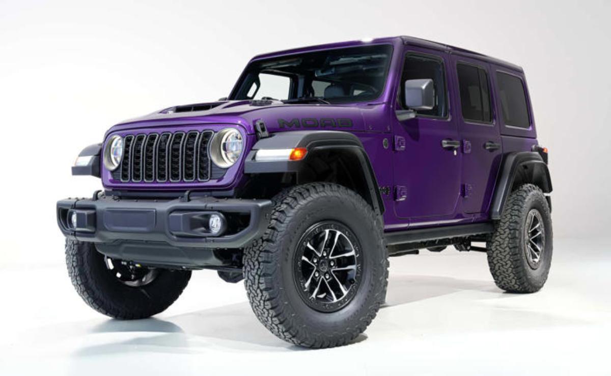 A purple Jeep Wrangler with off-road tires on a white background.