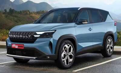 Blue Renault SUV parked on a road with mountains in the background.