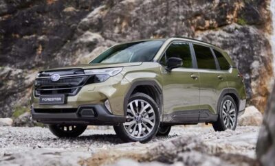 A rugged green SUV parked on rocky terrain.
