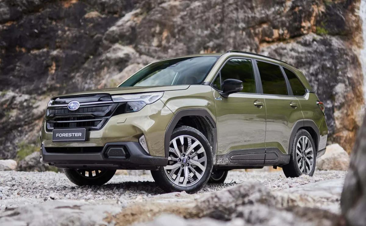 A rugged green SUV parked on rocky terrain.
