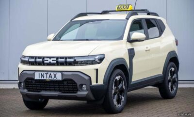 A modern white taxi SUV with black accents and roof sign.