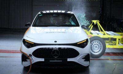 Front view of a white Mercedes-Benz car displayed indoors.