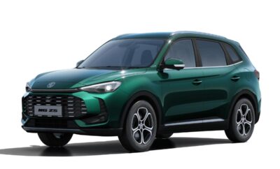 A sleek green SUV with modern design and sporty wheels.