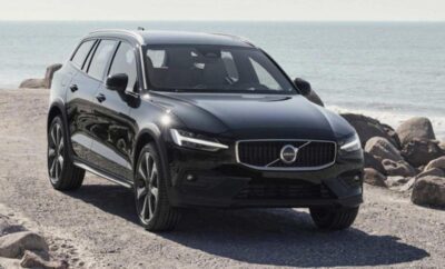 A sleek black Volvo SUV parked near the beach.