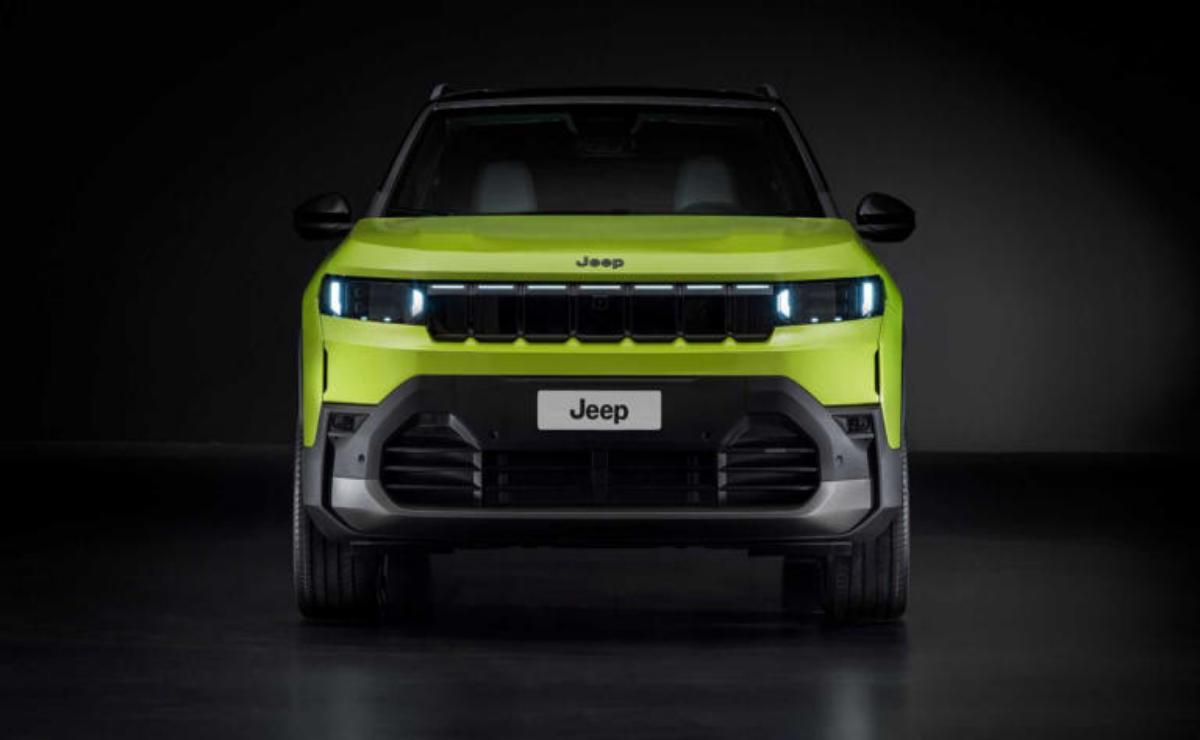 Front view of a bright green Jeep with sleek headlights and bold grille design.