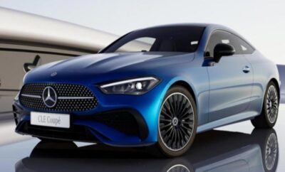 A sleek blue luxury coupe with sporty design and black alloy wheels.