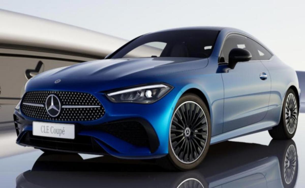 A sleek blue luxury coupe with sporty design and black alloy wheels.