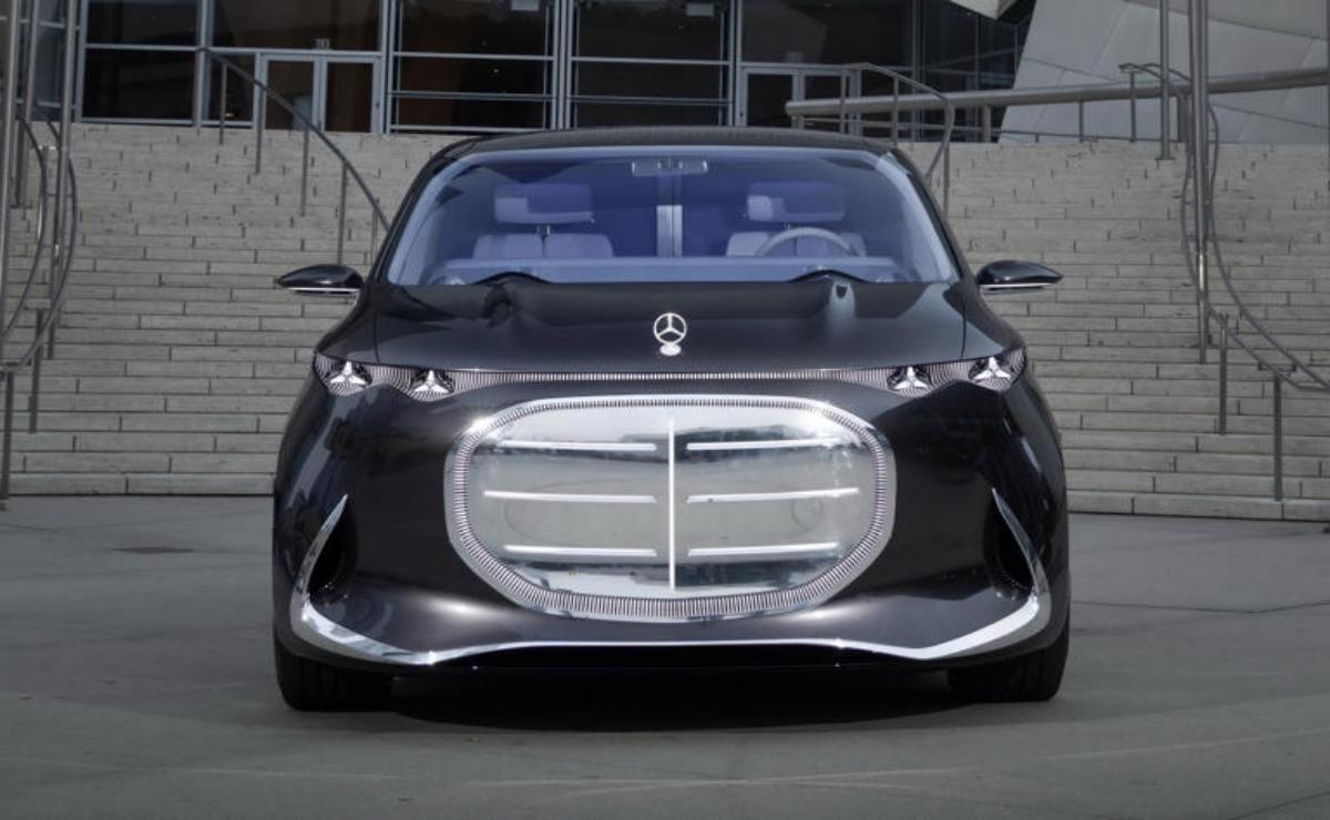 Futuristic black luxury car with a large silver grille and sleek design.