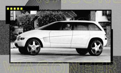 A sleek white luxury sedan parked on the street with modern design features.