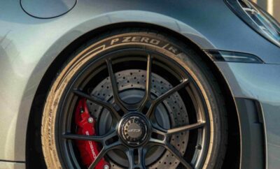 Close-up of a stylish car wheel with a Pirelli tire and red brake caliper.