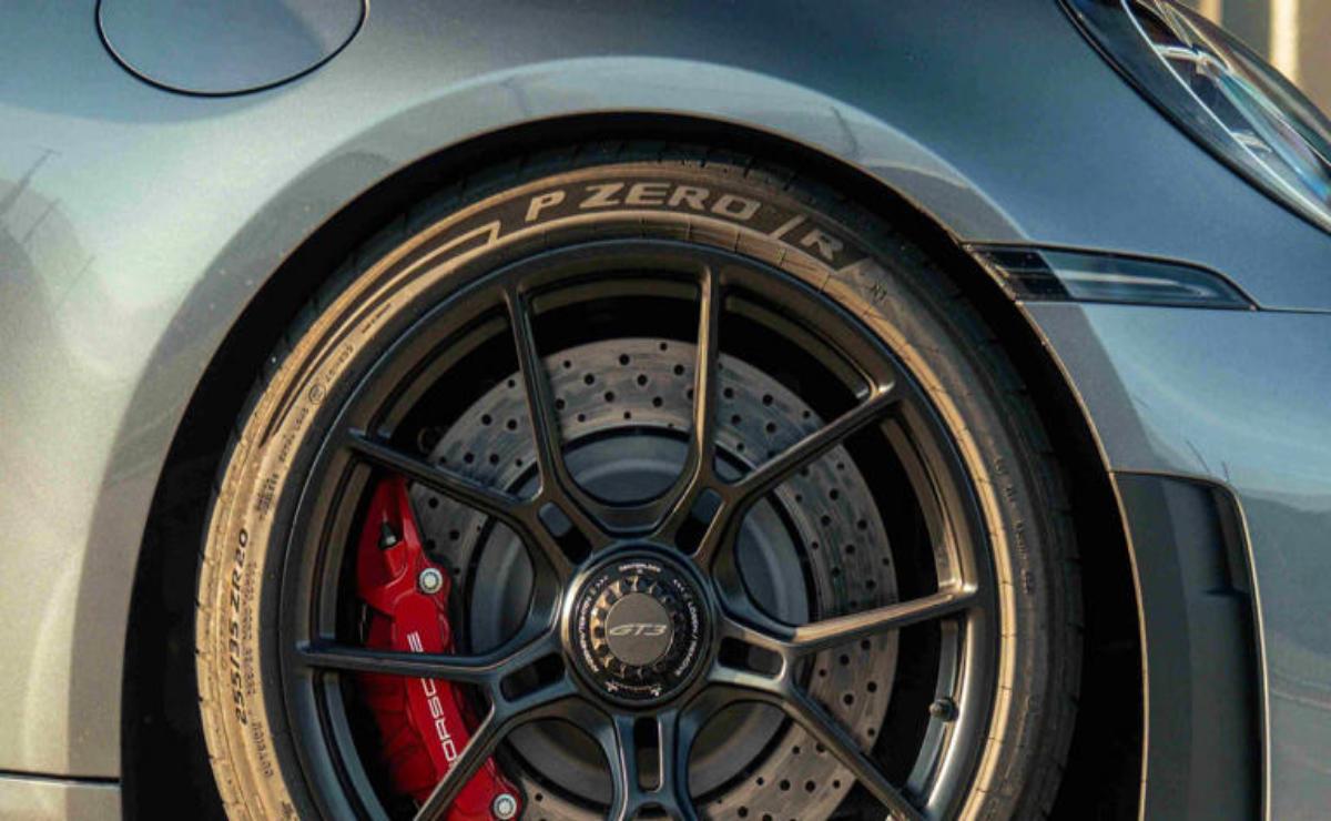 Close-up of a stylish car wheel with a Pirelli tire and red brake caliper.