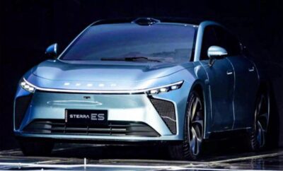 Sleek silver electric SUV with modern design and sharp headlights.