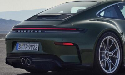 Rear view of a sleek Porsche sports car with distinctive tail lights.
