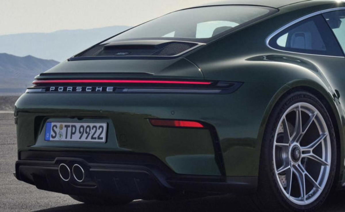 Rear view of a sleek Porsche sports car with distinctive tail lights.