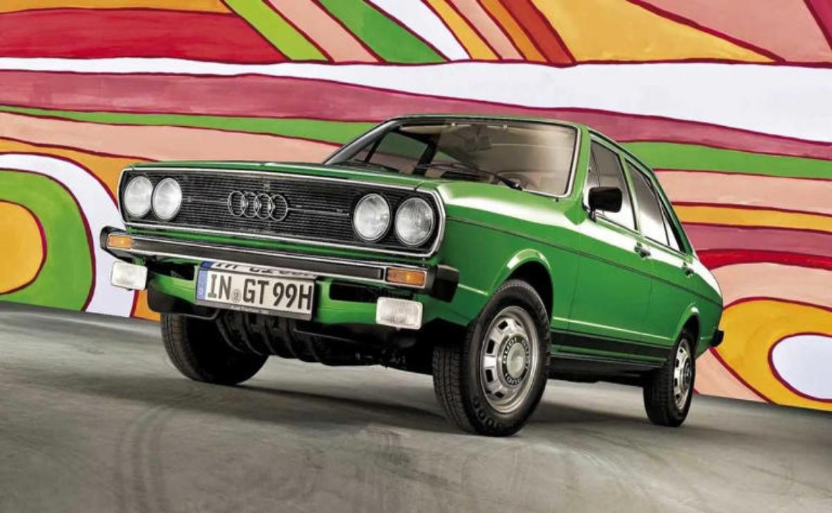 Classic green Volkswagen Golf Mk1 with colorful abstract background.