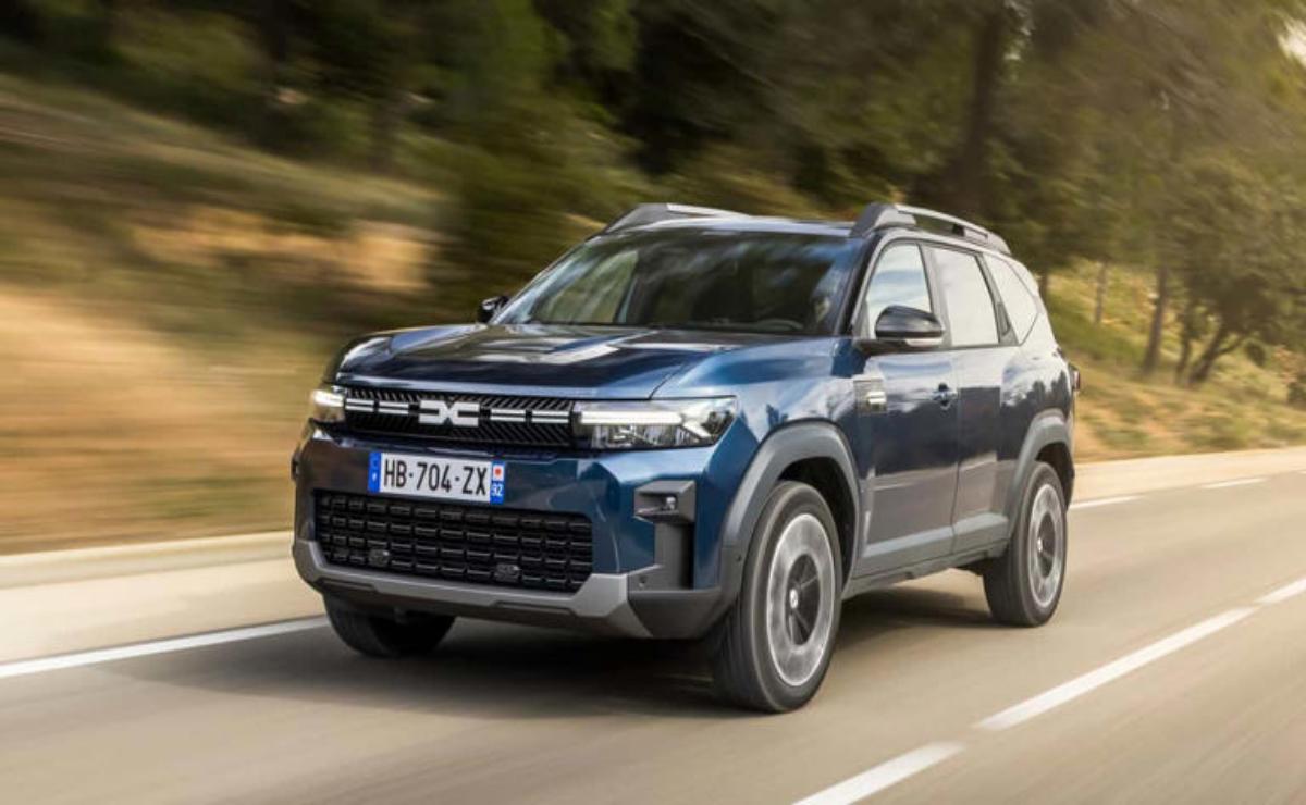 Blue SUV driving on a road with motion blur background.