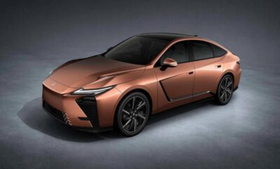 Sleek brown modern electric sedan with aerodynamic design.