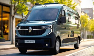 Modern black camper van parked outdoors with green trees in background.