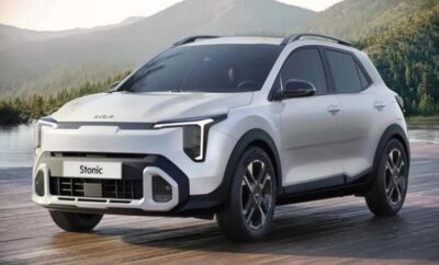Modern white electric SUV parked outdoors with mountains in the background.