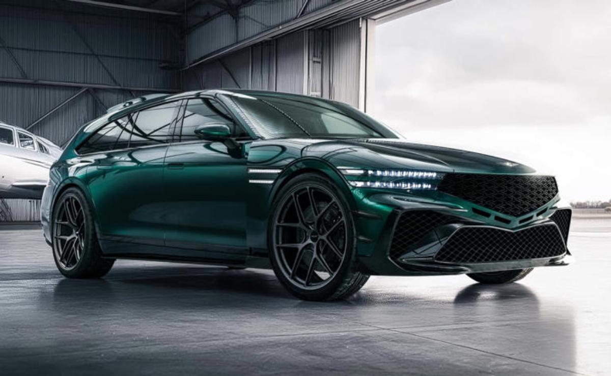Sleek dark green luxury sports car parked indoors.