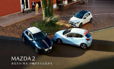 Three compact cars parked around a tree in a circular layout.
