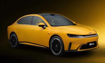 Sleek yellow electric car with modern design and black rims.