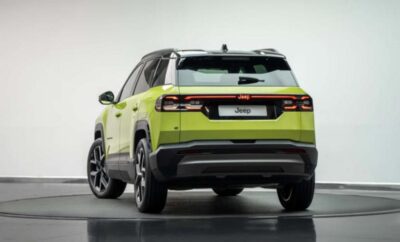 Rear view of a lime green SUV with modern taillights.