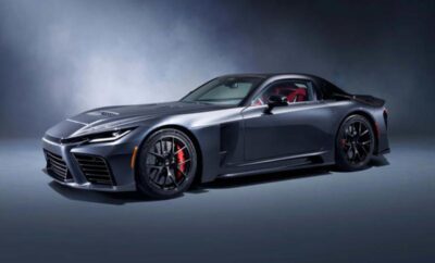 Sleek black sports car with red accents in a studio setting.