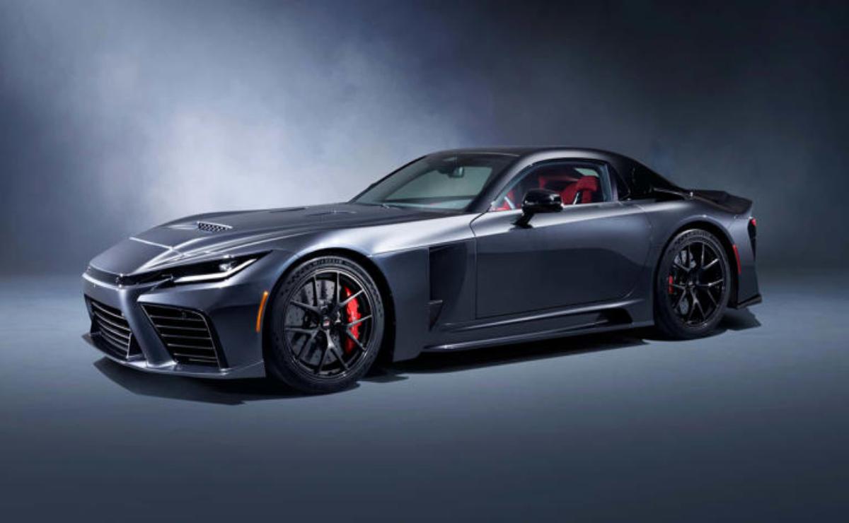 Sleek black sports car with red accents in a studio setting.