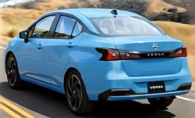 Rear view of a blue Nissan Versa sedan parked outdoors.