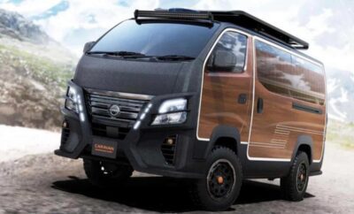 A compact black van with wood panel accents and rugged features.