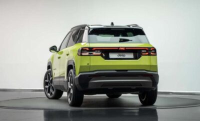 Rear view of a lime green Citroën C5 Aircross SUV on display.