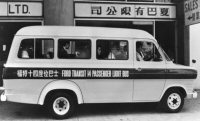 Vintage black and white photo of a Ford Transit van with Chinese characters on the side.