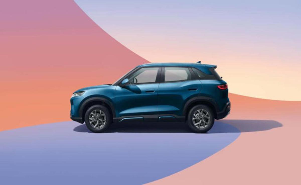 Side view of a blue SUV against a colorful gradient background.