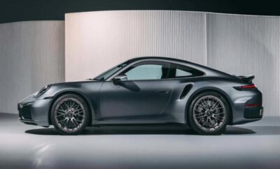 A sleek black sports car with modern design and large wheels.