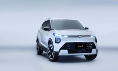 Sleek silver electric SUV parked on a plain background.