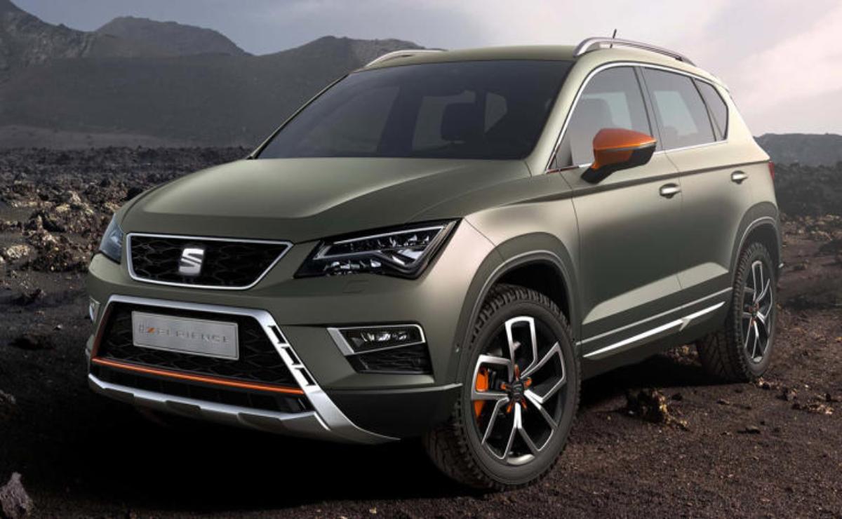 A rugged SUV parked outdoors with mountains in the background.