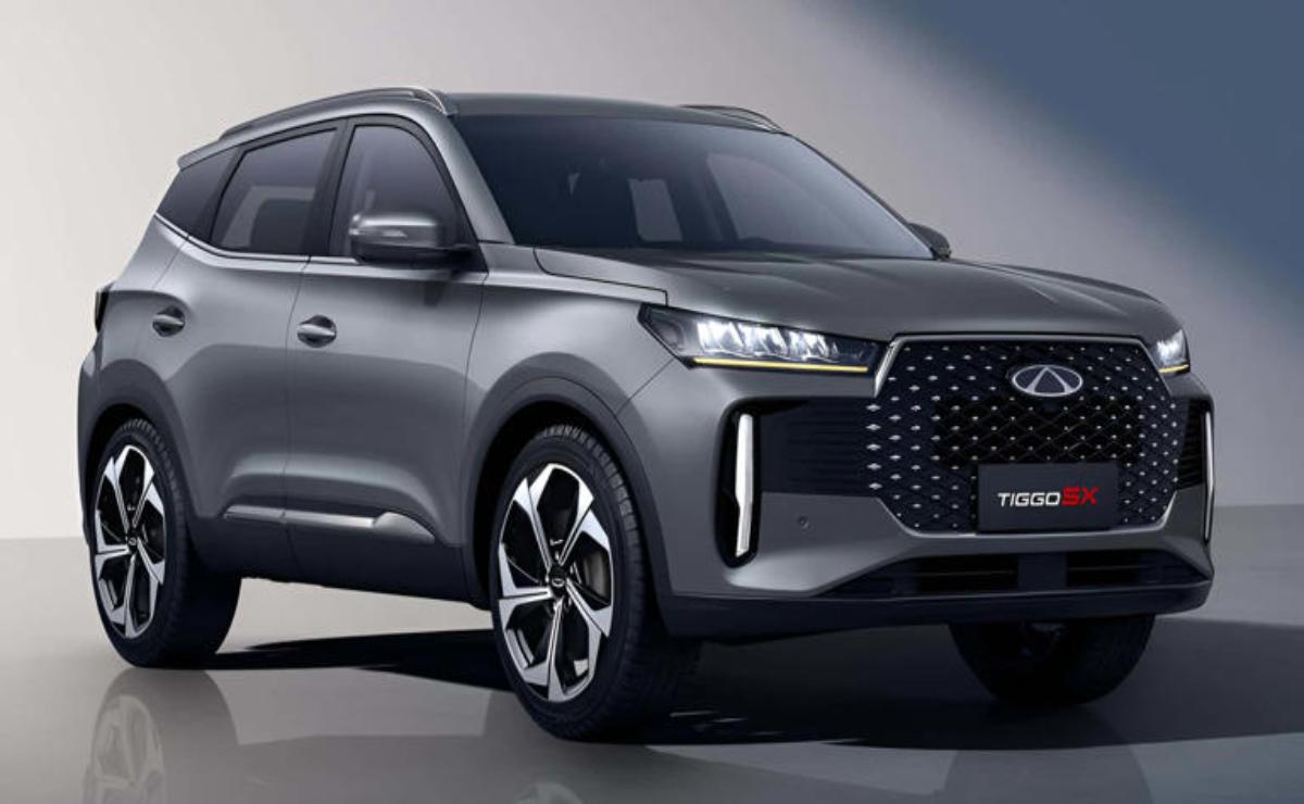Sleek gray SUV with modern design and LED headlights in a studio setting.